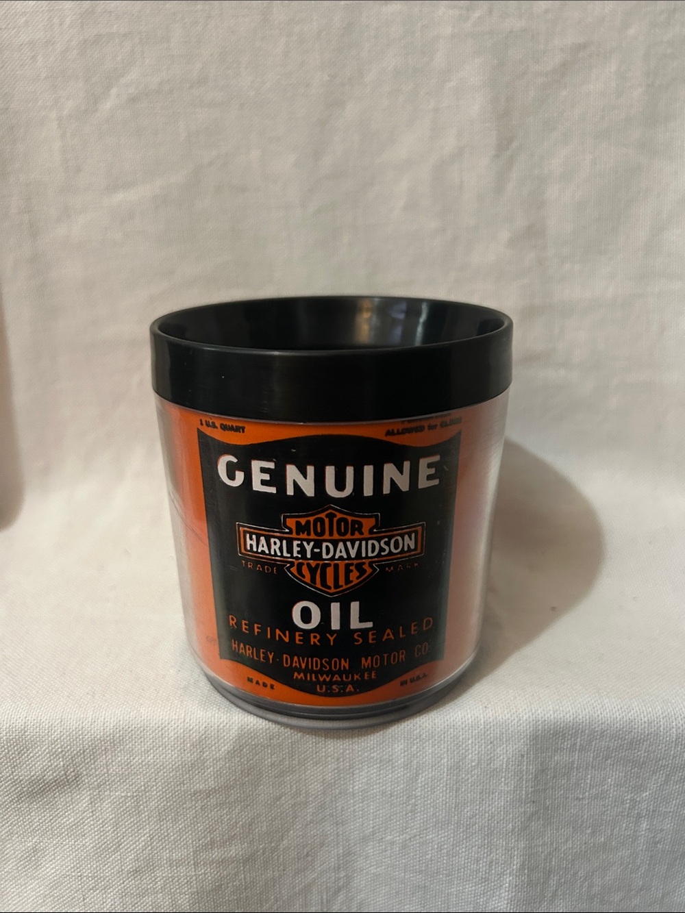 Harley-Davidson Black & Orange Plastic Mug 
Looks like a genuine oil canister.